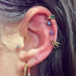 Cartilage piercing at Titan Piercing. The image displays a well-placed cartilage piercing adorned with a sleek earring, highlighting the studio's precision and commitment to safe and stylish ear piercings.